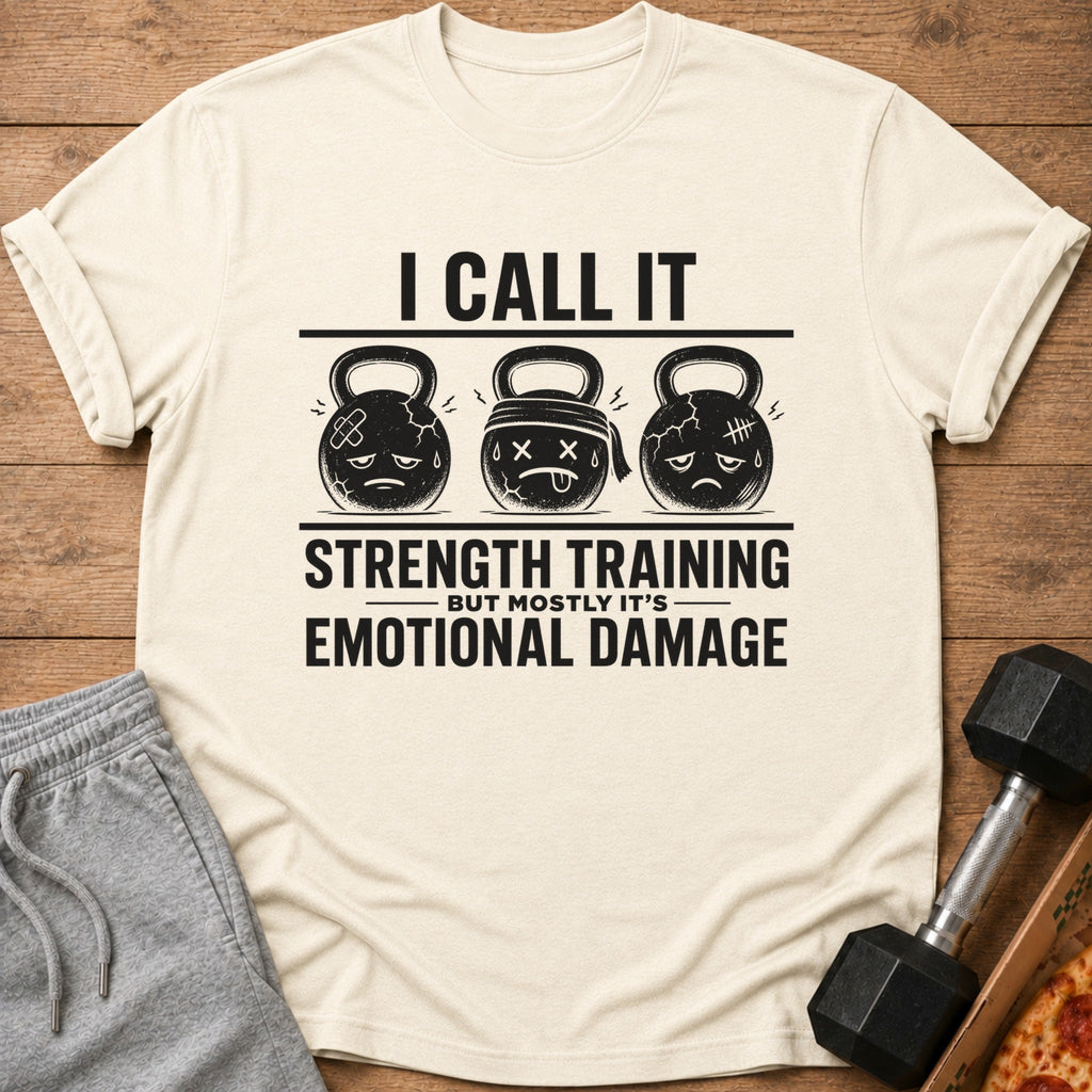 Cream t-shirt with "I Call It Strength Training But Mostly It's Emotional Damage" text and cartoon kettlebells.