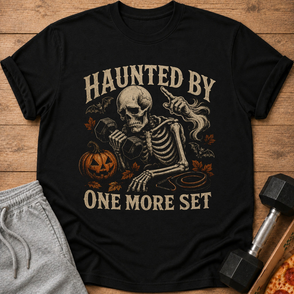 Skeleton lifting weights with pumpkin and bats, text "Haunted By One More Set".