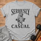 Grey t-shirt with black text "SERIOUSLY CASUAL" and a drawing of a capybara lifting dumbbells.