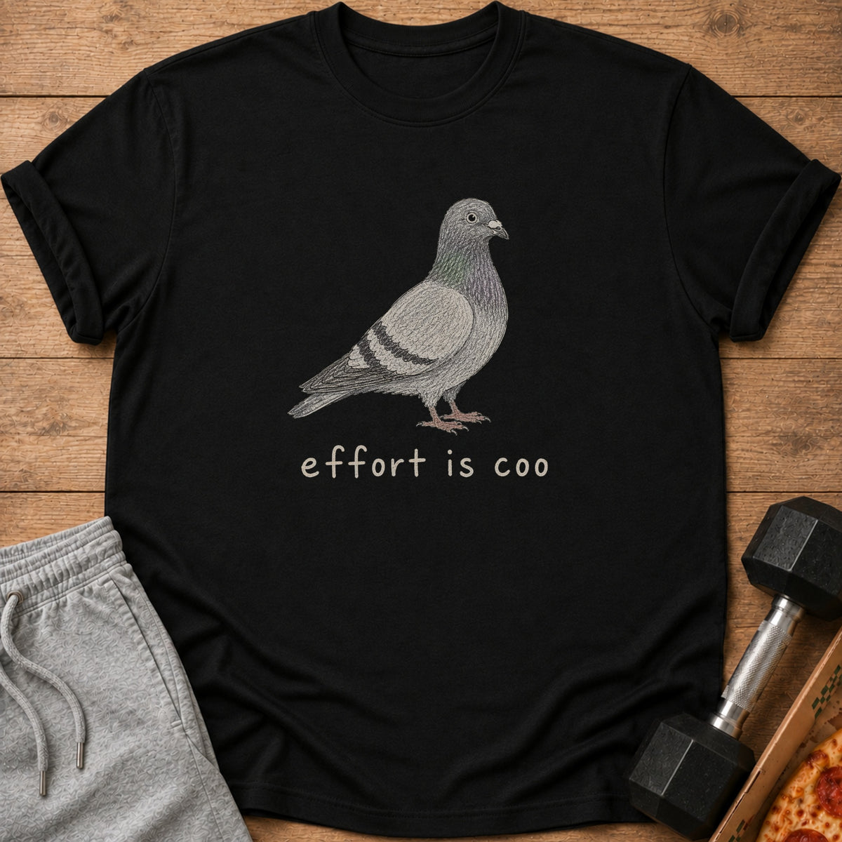 Black t-shirt with a pigeon graphic and text "effort is coo".