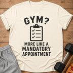 Cream t-shirt with black text "GYM? MORE LIKE A MANDATORY APPOINTMENT."