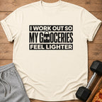 T-shirt with "I workout so my groceries feel lighter" text and grocery bag icon.