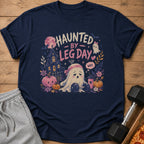 Navy t-shirt with "Haunted By Leg Day Why" text and a sad ghost with a barbell.