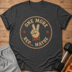Dark grey t-shirt with "One More Rep.. Maybe" text and peace sign graphic.