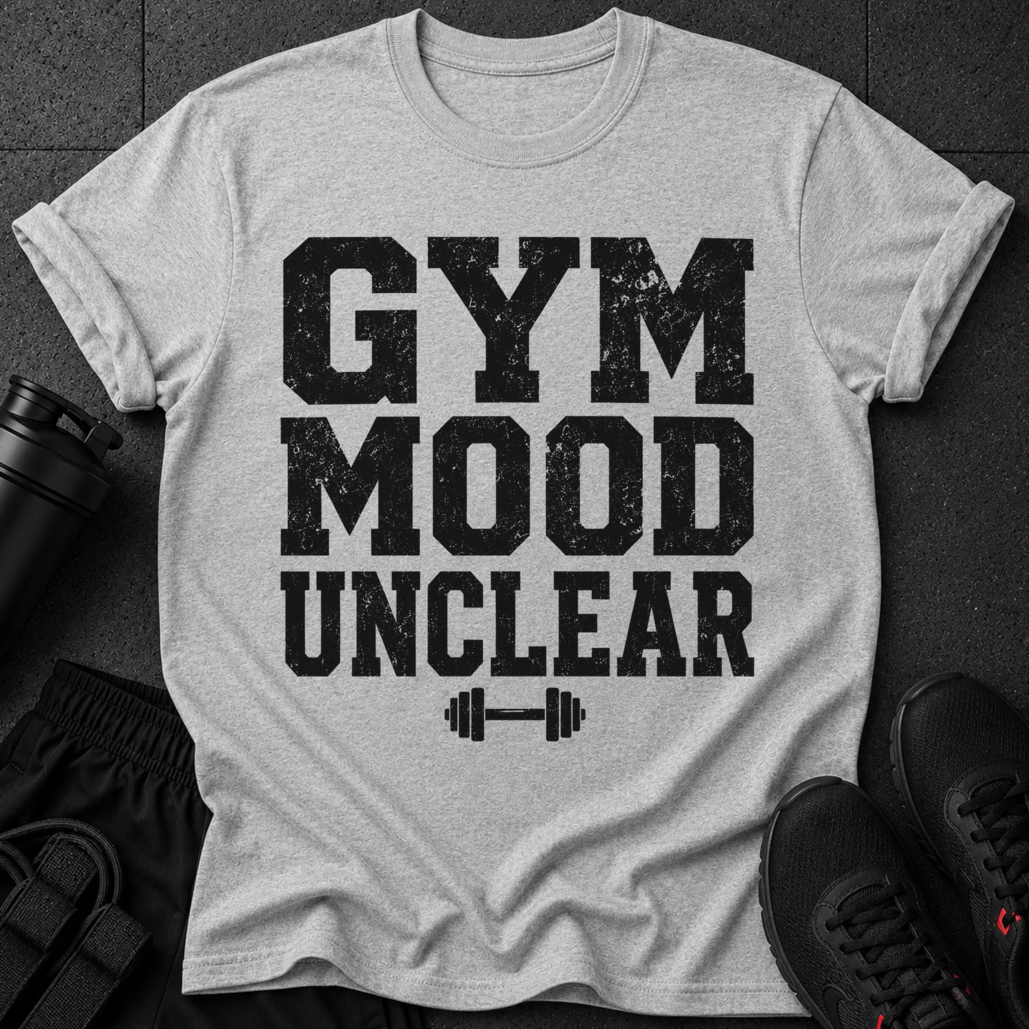 Grey t-shirt with black text reading "GYM MOOD UNCLEAR" and a dumbbell graphic.