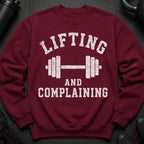 Maroon sweatshirt with white text "Lifting and Complaining" and a dumbbell design.