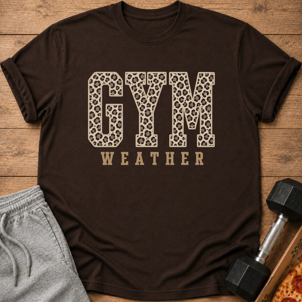 Brown t-shirt with "GYM WEATHER" text in leopard print and beige font.