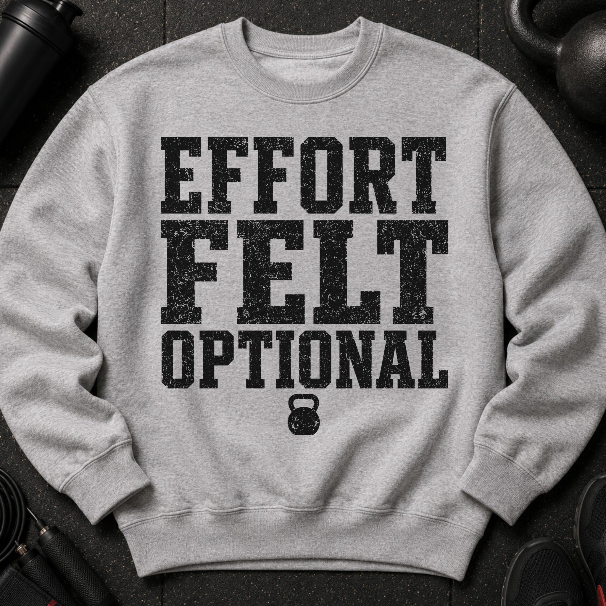 Gray sweatshirt with black distressed text reading "EFFORT FELT OPTIONAL" and a kettlebell.