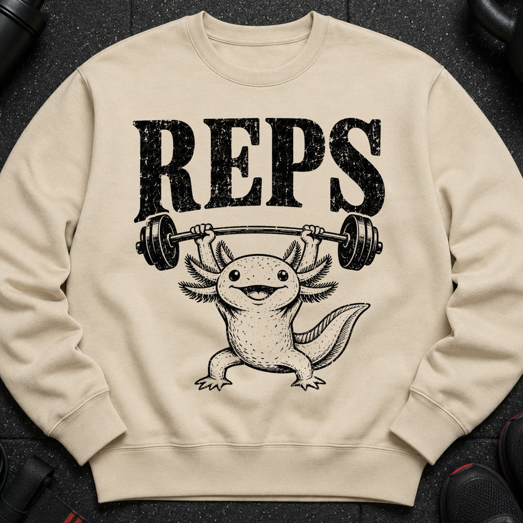 Axolotl lifting barbell with text REPS printed on a beige sweatshirt.