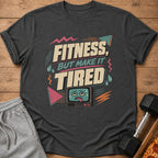 T-shirt with "Fitness, But Make It Tired" text and a tired cartoon TV.