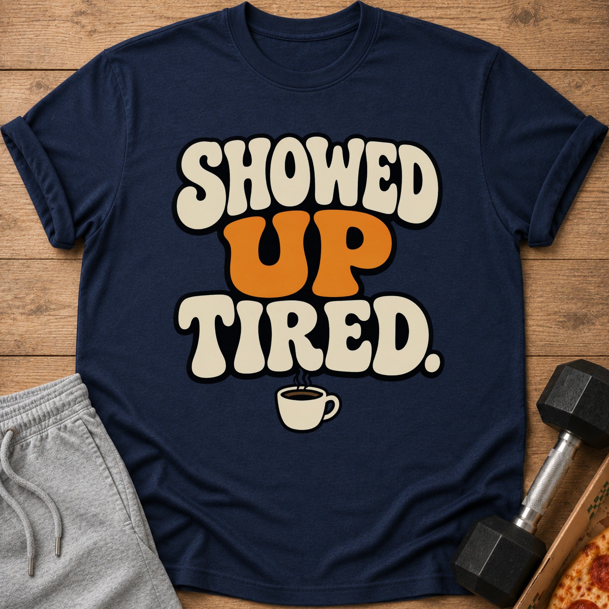 Navy t-shirt with "SHOWED UP TIRED" text and coffee cup graphic.