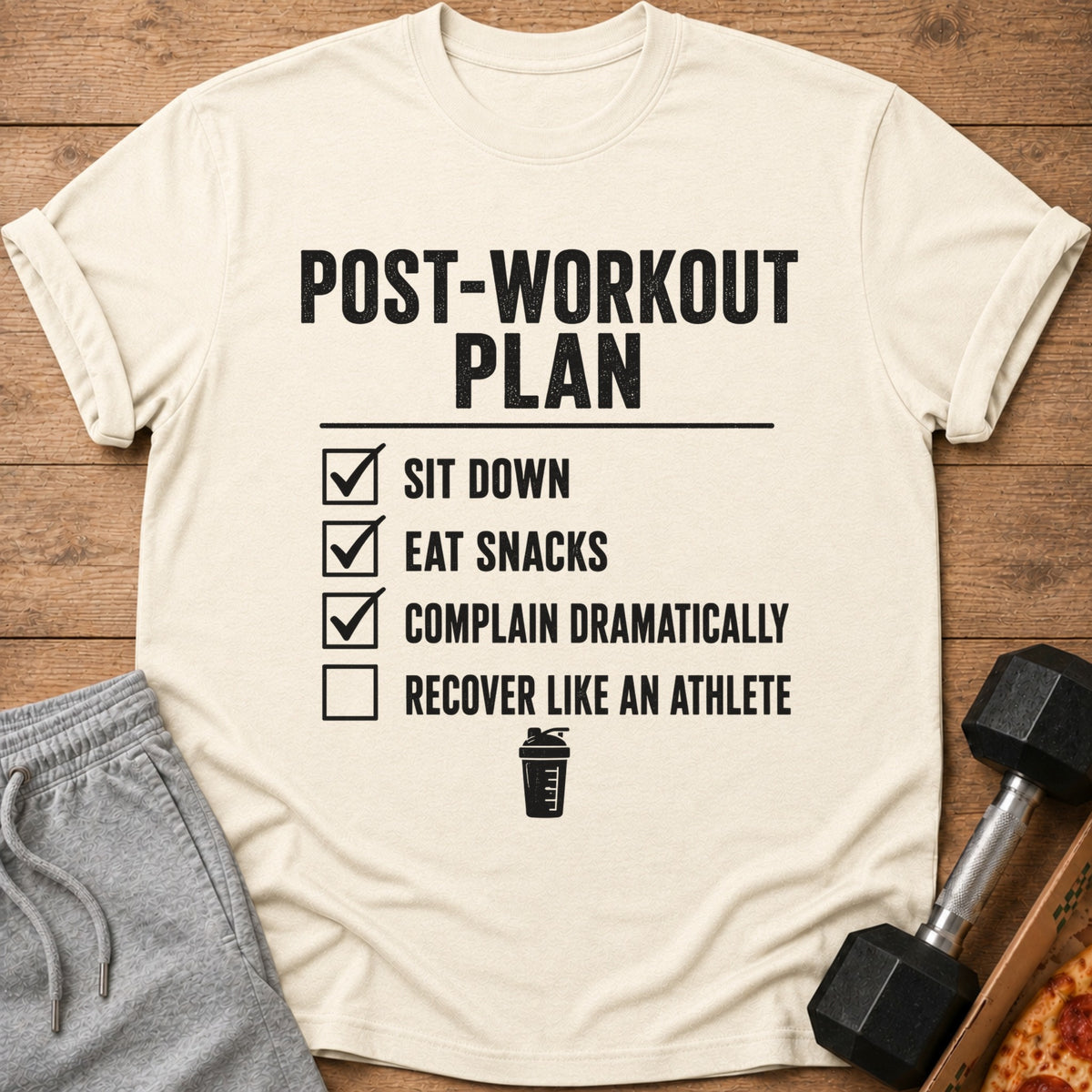 T-shirt with "Post-Workout Plan" text, listing sit down, eat snacks, complain, and recover.
