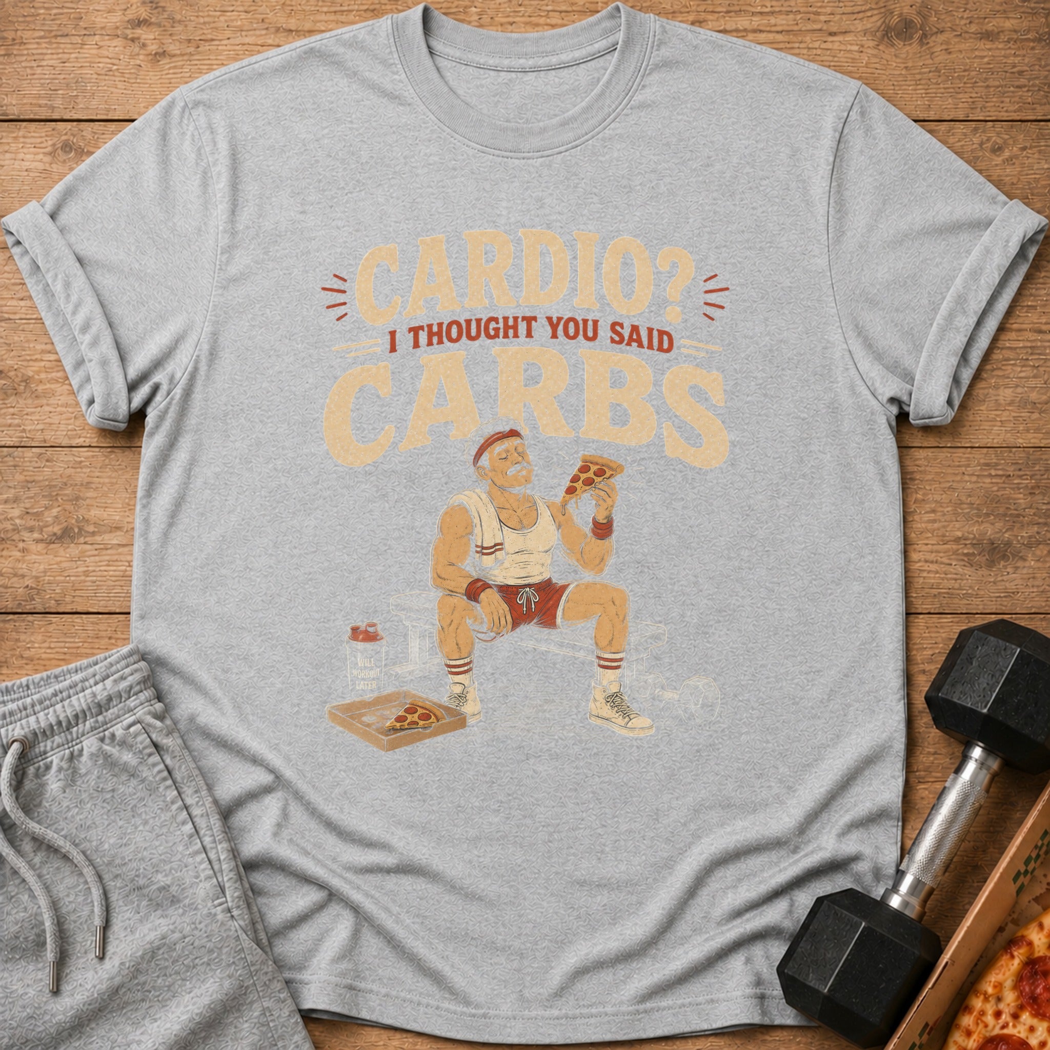Gray t-shirt with "Cardio? I Thought You Said Carbs" text and man eating pizza.