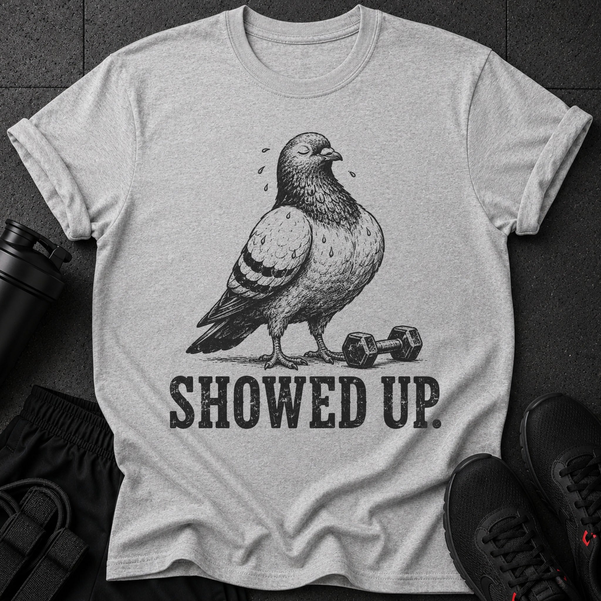 Pigeon with closed eyes, sweat drops, dumbbell, and text "SHOWED UP."