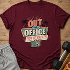 Maroon t-shirt with "Out of Office, Out of Breath" graphic and a vintage suitcase.