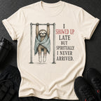 Cream t-shirt with sloth on pull-up bar and text "I showed up late but spiritually I never arrived."