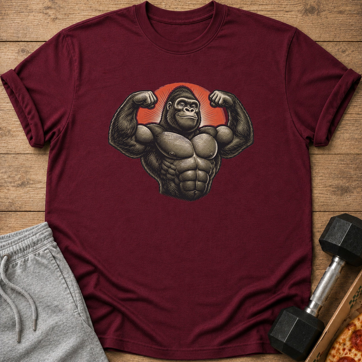 Maroon t-shirt with a muscular gorilla graphic flexing its arms.