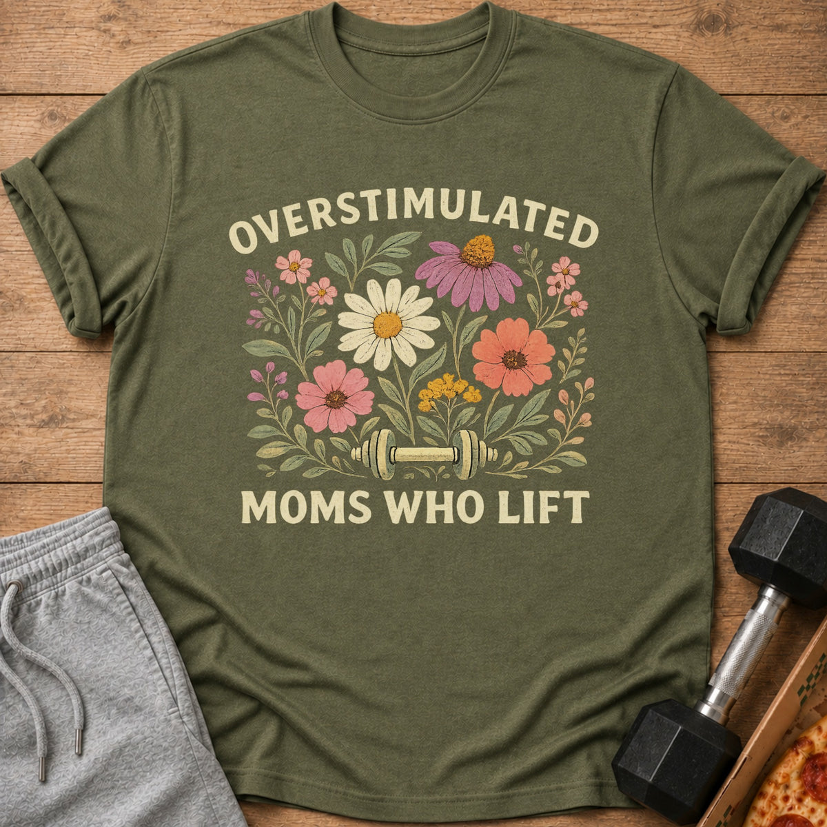 Green t-shirt with "Overstimulated Moms Who Lift" and floral dumbbell graphic.