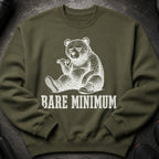 Olive sweatshirt with a distressed white graphic of a bear lifting a dumbbell, text reads "BARE MINIMUM".