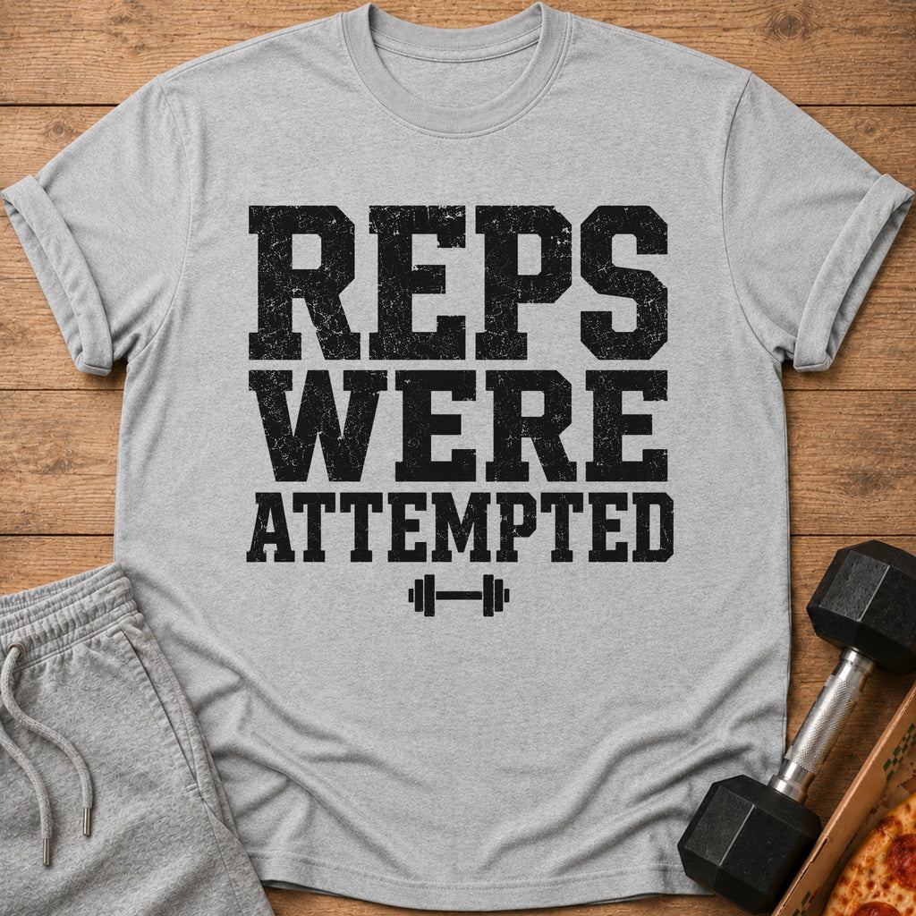 Grey t-shirt with black distressed text "REPS WERE ATTEMPTED" and dumbbell graphic.