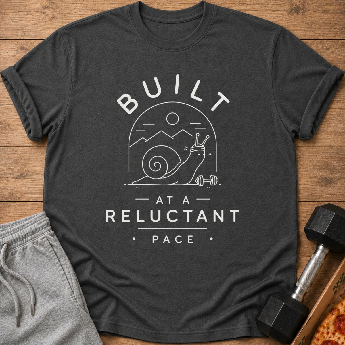 Dark grey t-shirt with white text and illustration of a snail.