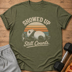 T-shirt with a sleepy panda and text "Showed Up Still Counts."