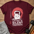 Maroon t-shirt with a kettlebell graphic and "Lifting in Silent Disapproval" text.