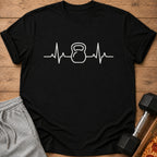Black t-shirt with white kettlebell heartbeat graphic.