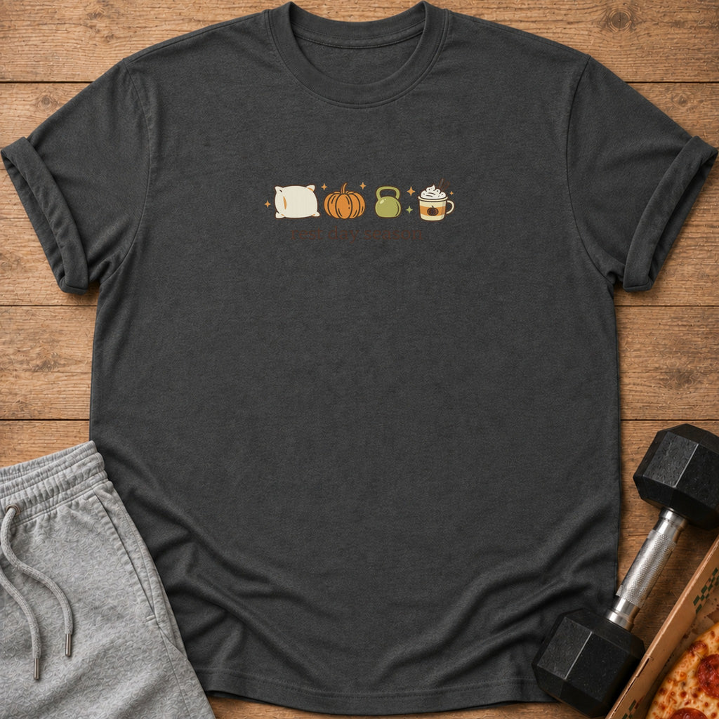 Dark grey t-shirt with pillow, pumpkin, kettlebell, and coffee icons and "rest day season" text.