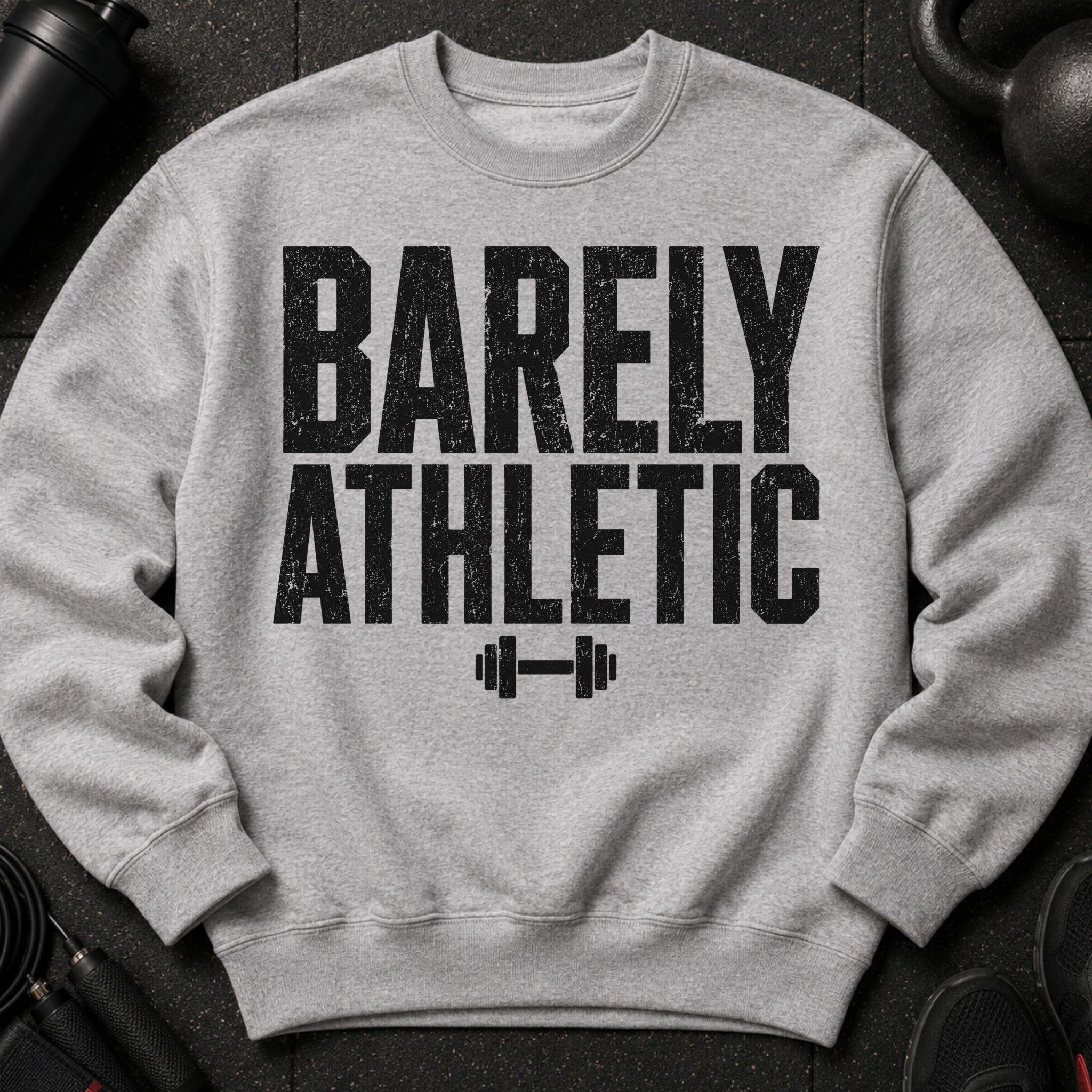 Grey crewneck sweatshirt with "BARELY ATHLETIC" text and dumbbell graphic.