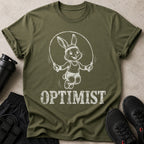 Green t-shirt with a white graphic of a cartoon bunny jumping rope and the word OPTIMIST.