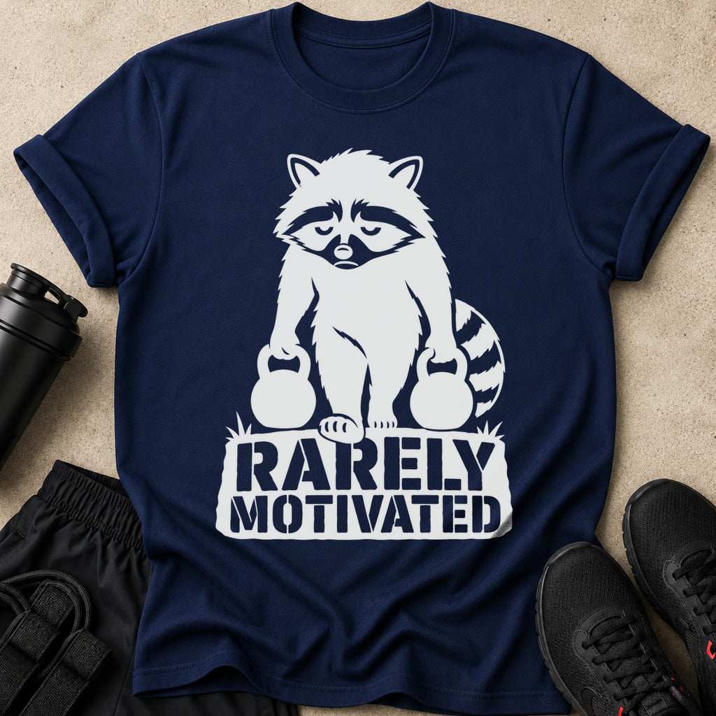 Navy t-shirt with white graphic of a raccoon holding kettlebells and text "RARELY MOTIVATED".