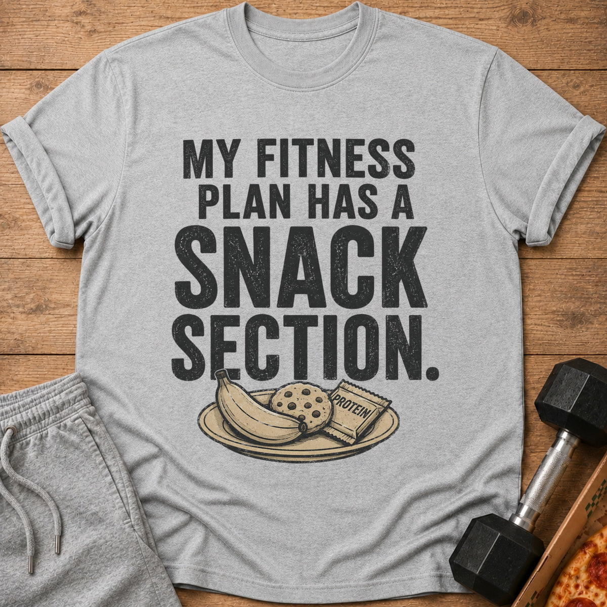 Grey t-shirt with "My Fitness Plan Has A Snack Section" text and snacks.