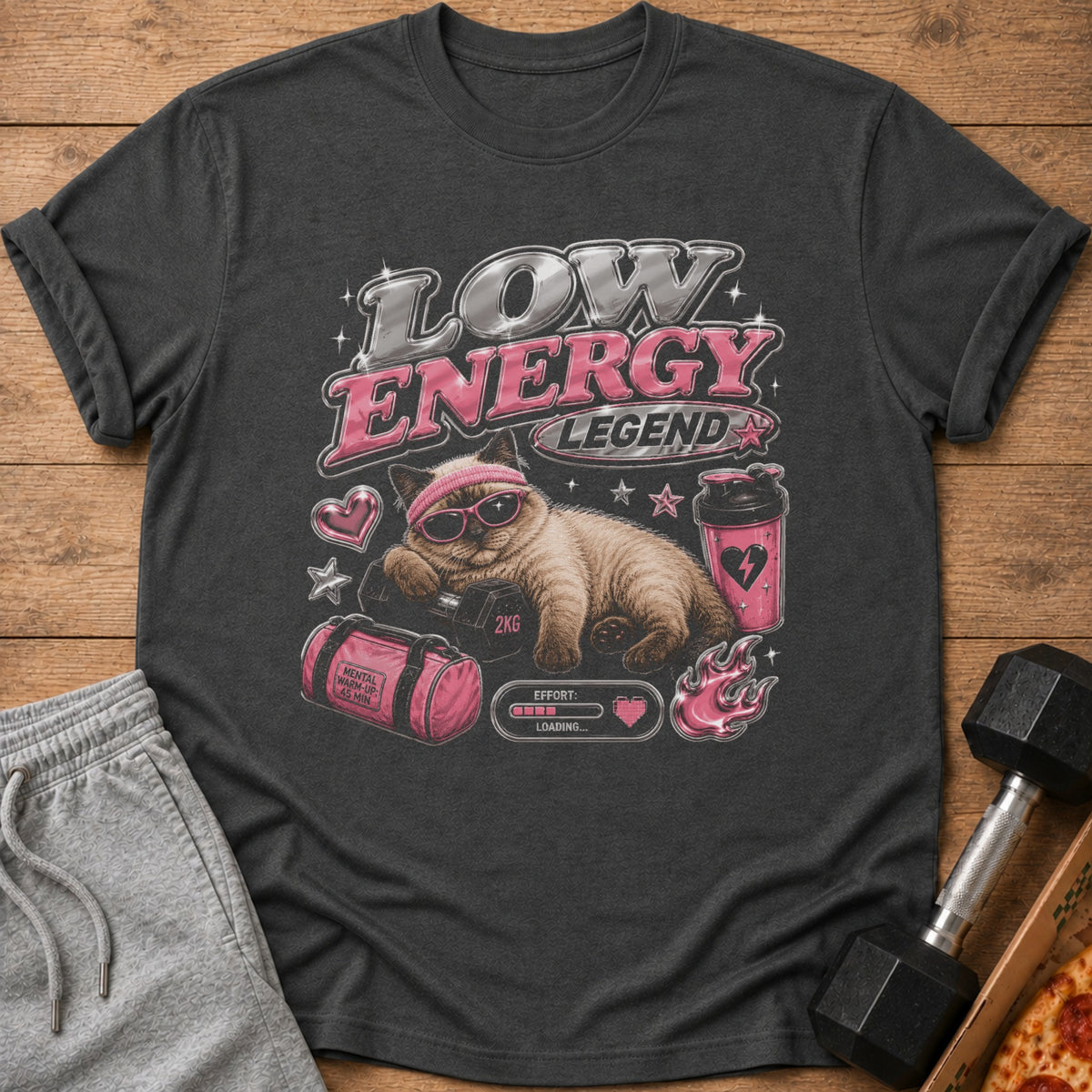 T-shirt graphic of cat with sunglasses and headband on dumbbell, reading "Low Energy Legend".