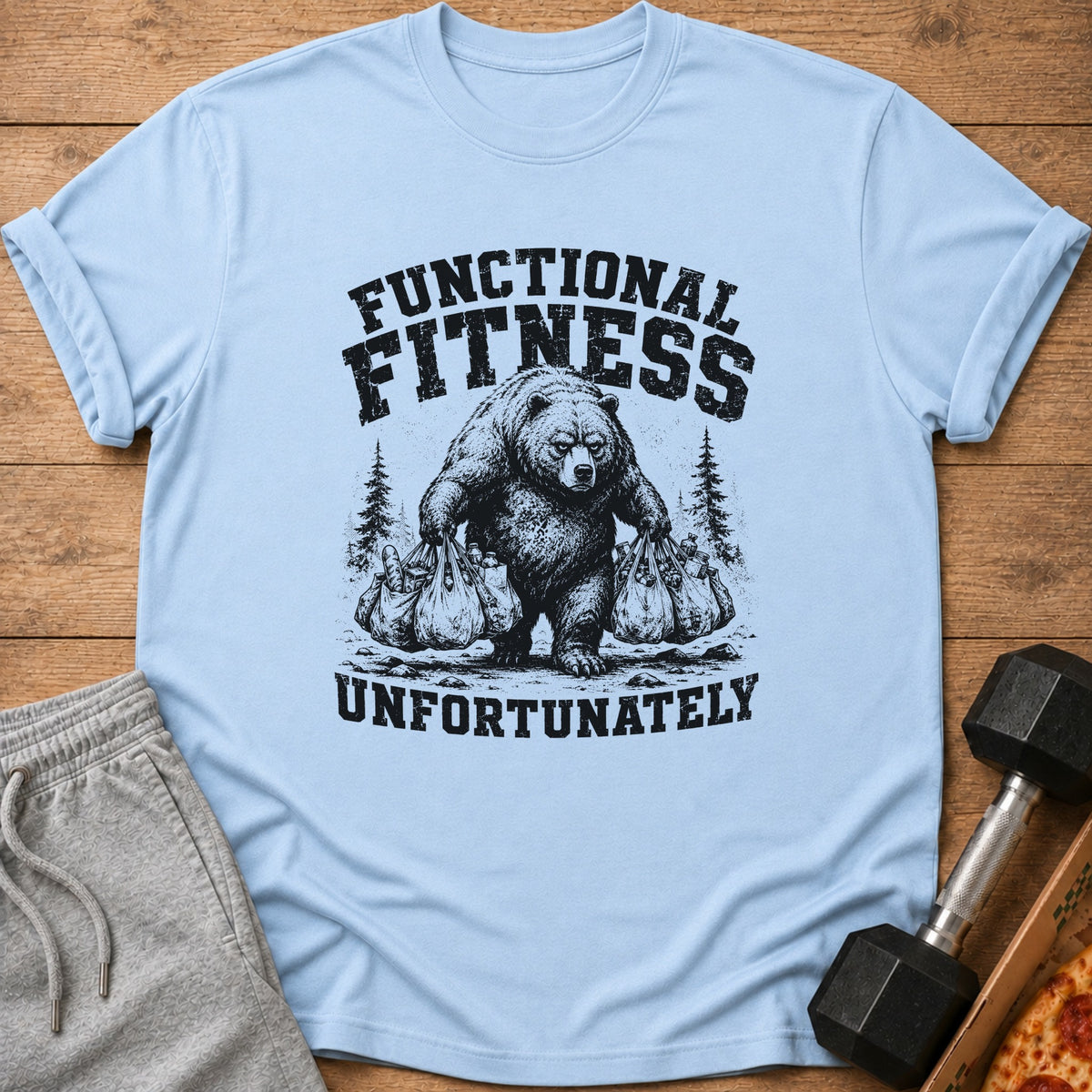 Light blue t-shirt with bear carrying groceries and text "FUNCTIONAL FITNESS UNFORTUNATELY."