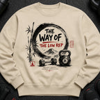 Crewneck sweatshirt with Japanese-inspired graphic of weights, bamboo, and mountains.