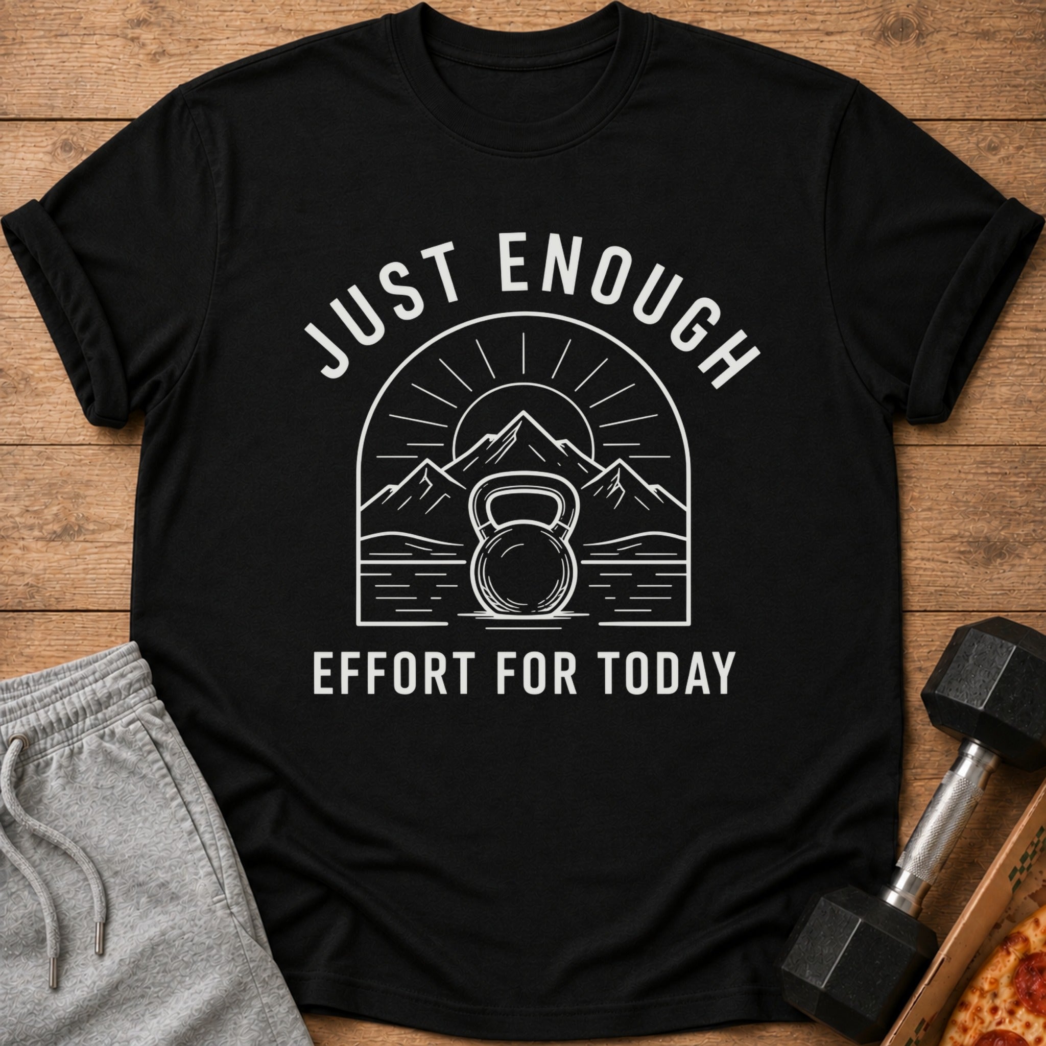 Black t-shirt with kettlebell, mountains, and text "JUST ENOUGH EFFORT FOR TODAY".