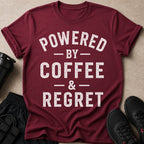 Maroon t-shirt with "POWERED BY COFFEE & REGRET" white distressed text.