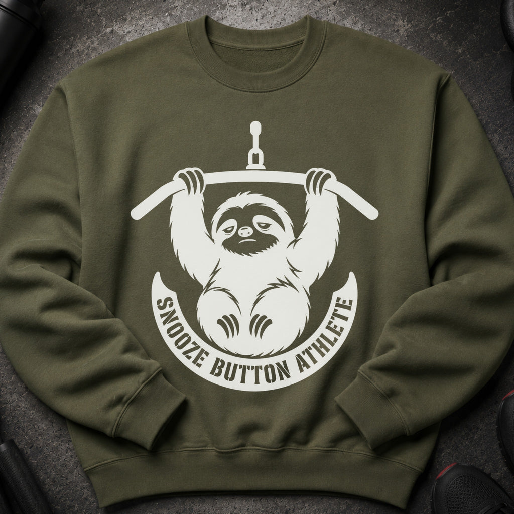 Olive green sweatshirt with white snooze button athlete sloth graphic.