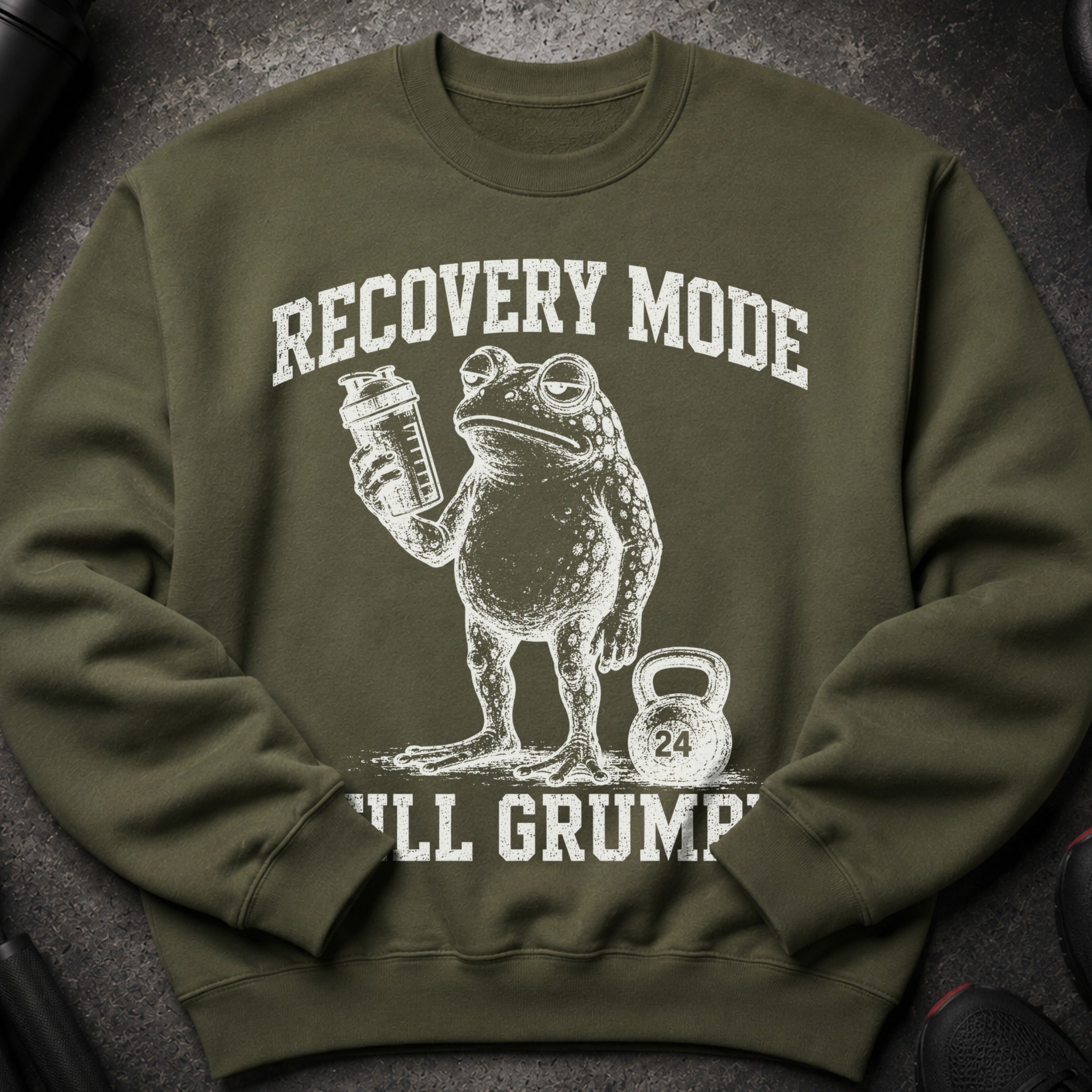 Green sweatshirt with a frog holding a shaker, text "RECOVERY MODE" and "I'LL GRUMP".