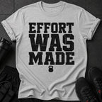 Grey t-shirt with black distressed text "EFFORT WAS MADE" and a kettlebell icon.