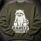 Green sweatshirt with a white graphic of a raccoon holding dumbbells and the text "Rarely Motivated".