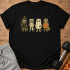 Four raccoons in Halloween costumes: witch, mummy, ghost, and pumpkin.