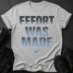 Grey t-shirt with "EFFORT WAS MADE" text and a checkmark graphic.