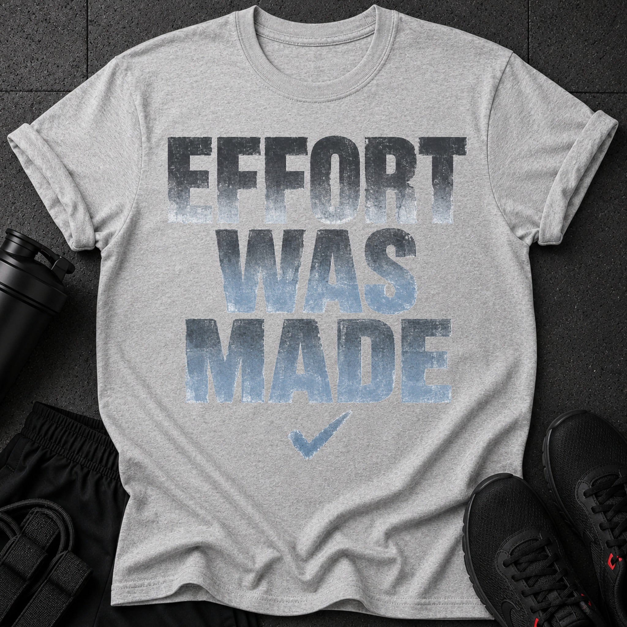 Grey t-shirt with "EFFORT WAS MADE" text and a checkmark graphic.