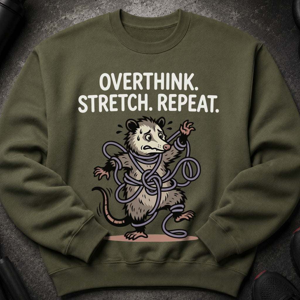 Olive green sweatshirt with "Overthink. Stretch. Repeat." and a tangled possum graphic.