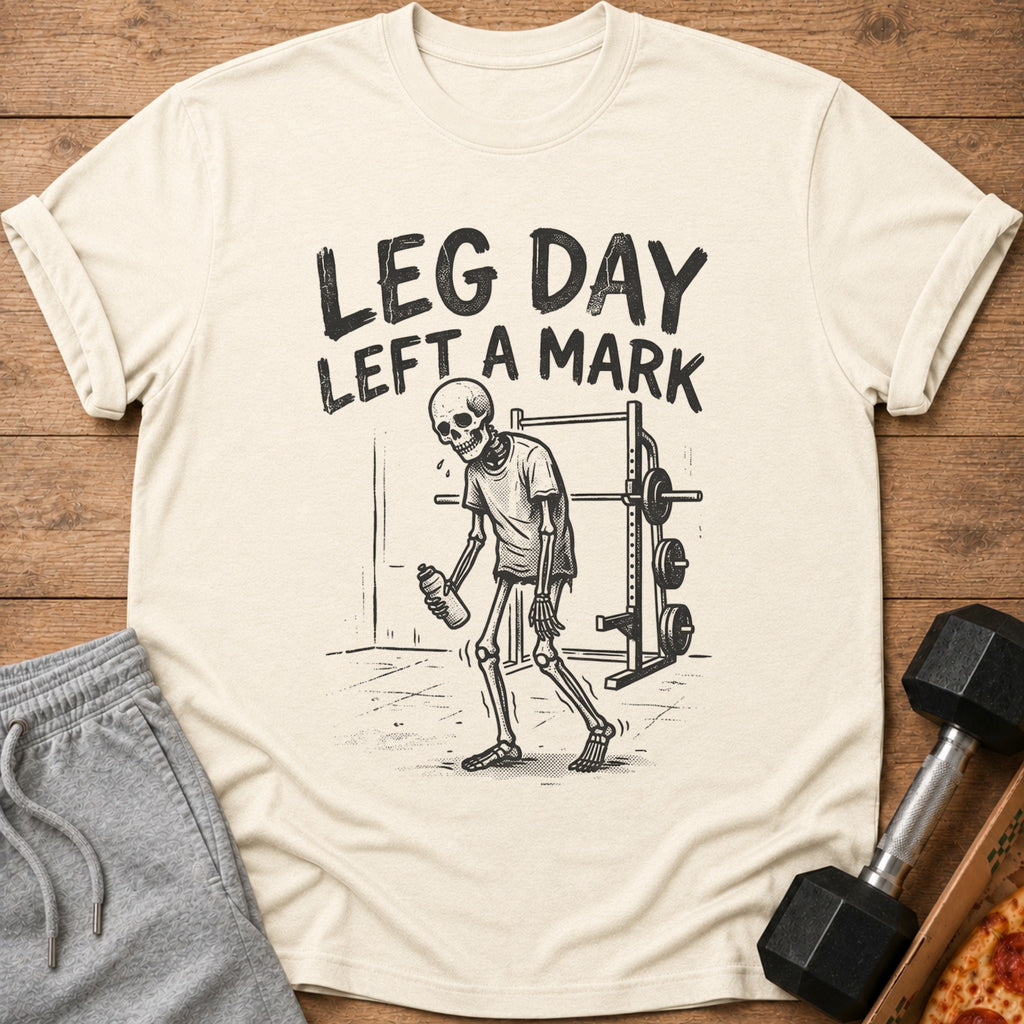 T-shirt with skeleton and text "LEG DAY LEFT A MARK" with dumbbells and pizza.