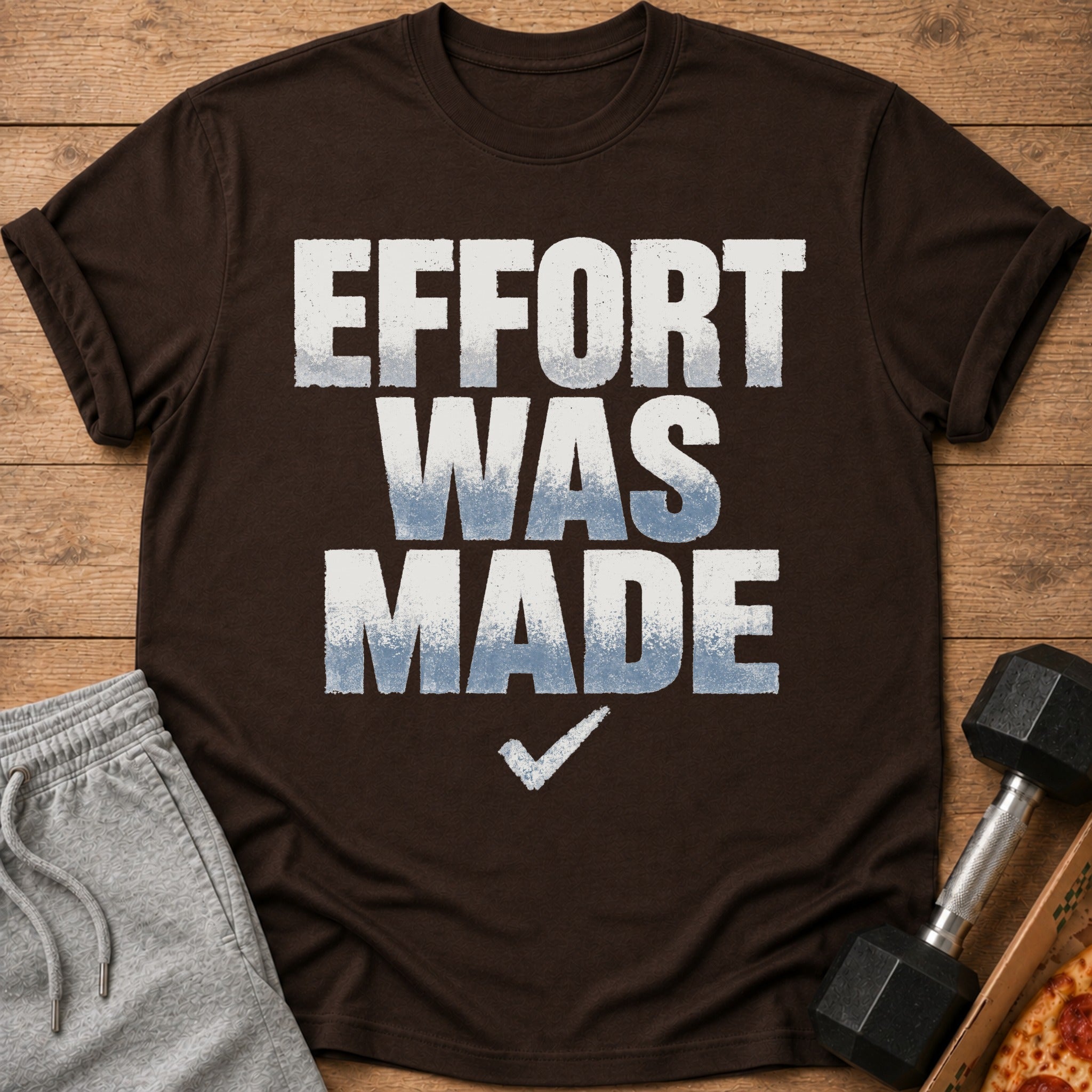 Brown t-shirt with "EFFORT WAS MADE" text and a white checkmark.