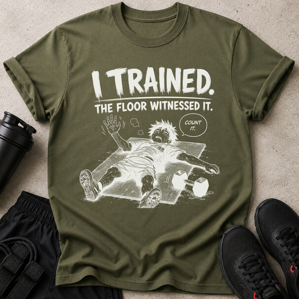 Green t-shirt with graphic of exhausted anime character and text "I TRAINED. THE FLOOR WITNESSED IT. COUNT IT."