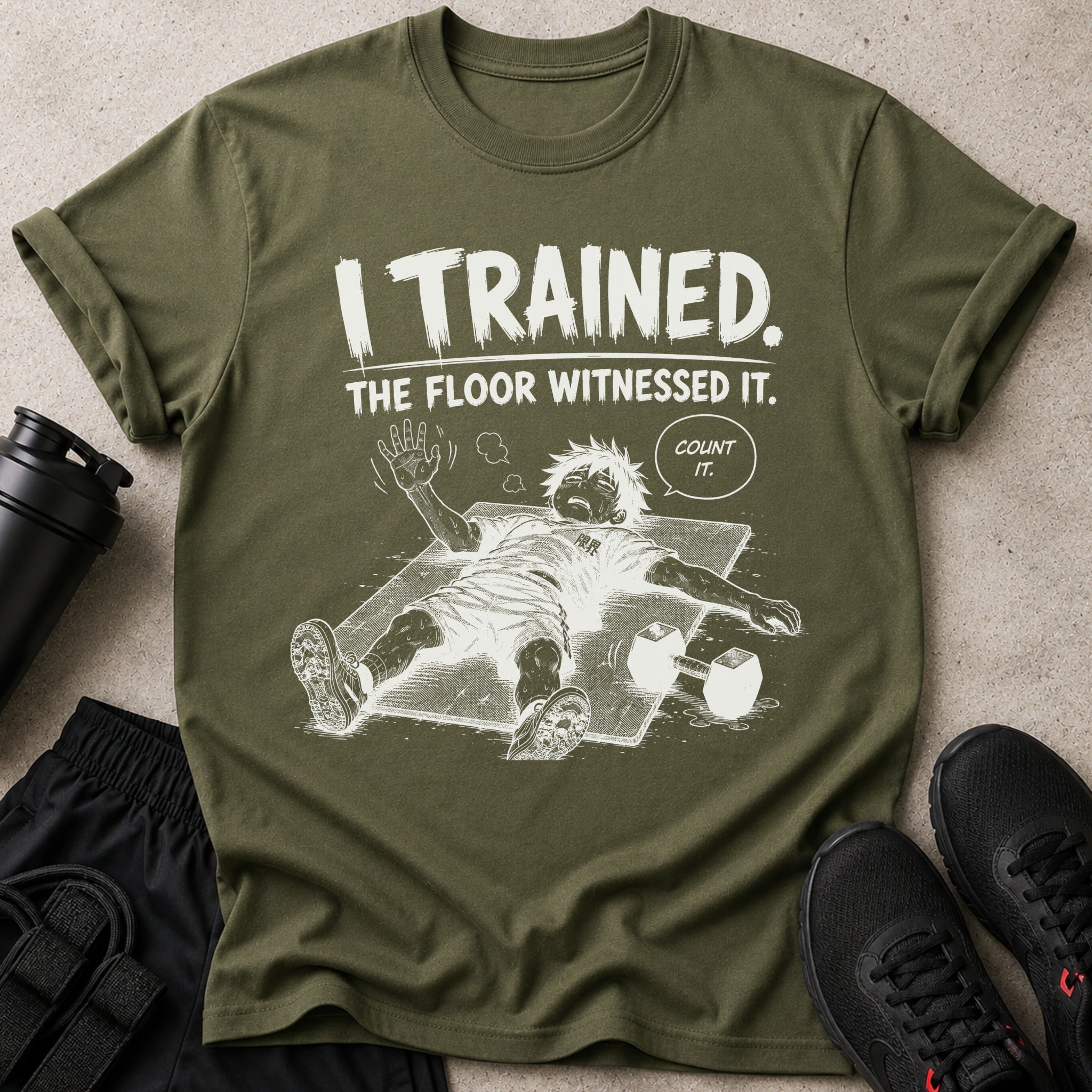 Green t-shirt with graphic of exhausted anime character and text "I TRAINED. THE FLOOR WITNESSED IT. COUNT IT."